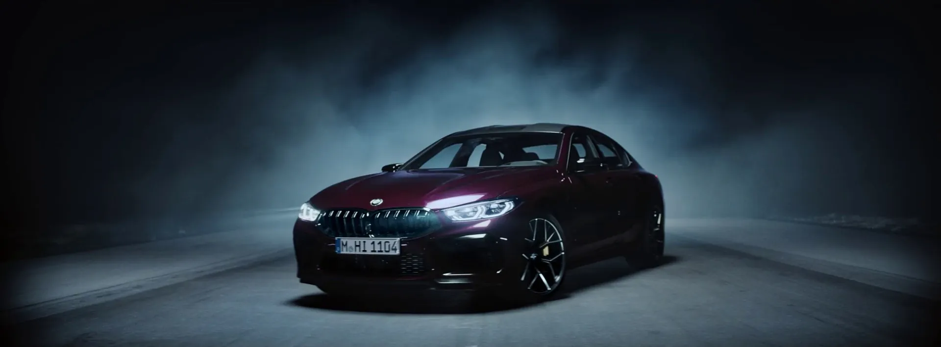 The M8 Gran Coupé at night in fog, lit by a drone carrying 65 000 lumens.