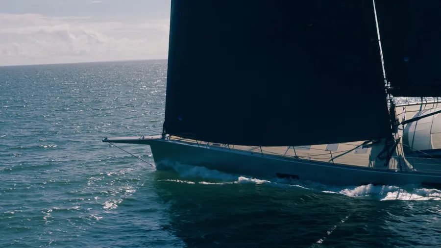 Low pass along the yacht's hull a metre above the water